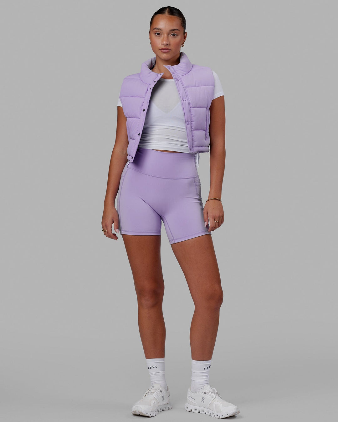 Woman wearing Fusion Ultra High-Rise 6" Short Pockets - Pale Lilac | Model:Milly | Size:S