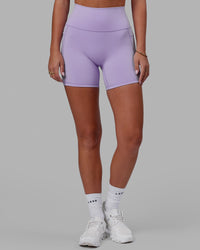 Woman wearing Fusion Ultra High-Rise 6" Short Pockets - Pale Lilac | Model:Milly | Size:S