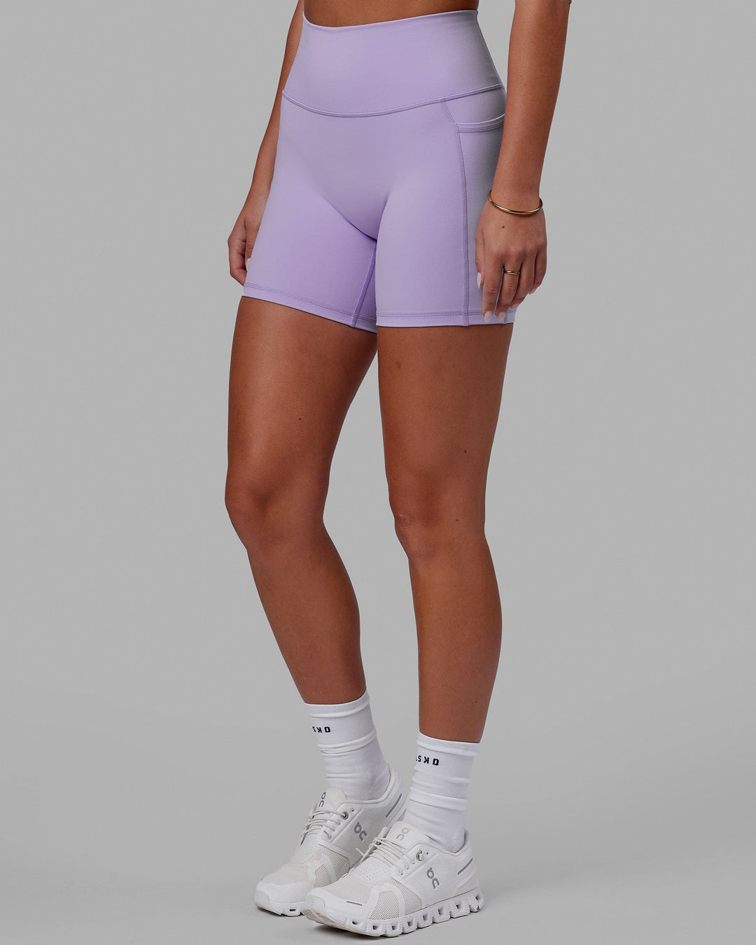 Woman wearing Fusion Ultra High-Rise 6" Short Pockets - Pale Lilac | Model:Milly | Size:S