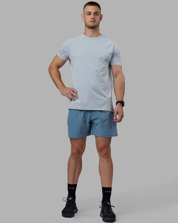 Man wearing Challenger 6&quot; Lined Performance Shorts - Elemental Blue
