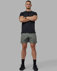 Man wearing Challenger 6" Performance Short - Graphite