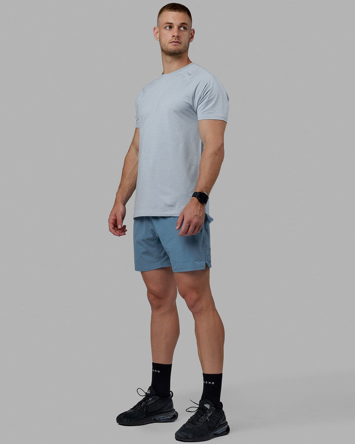 Man wearing Challenger 6&quot; Lined Performance Shorts - Elemental Blue
