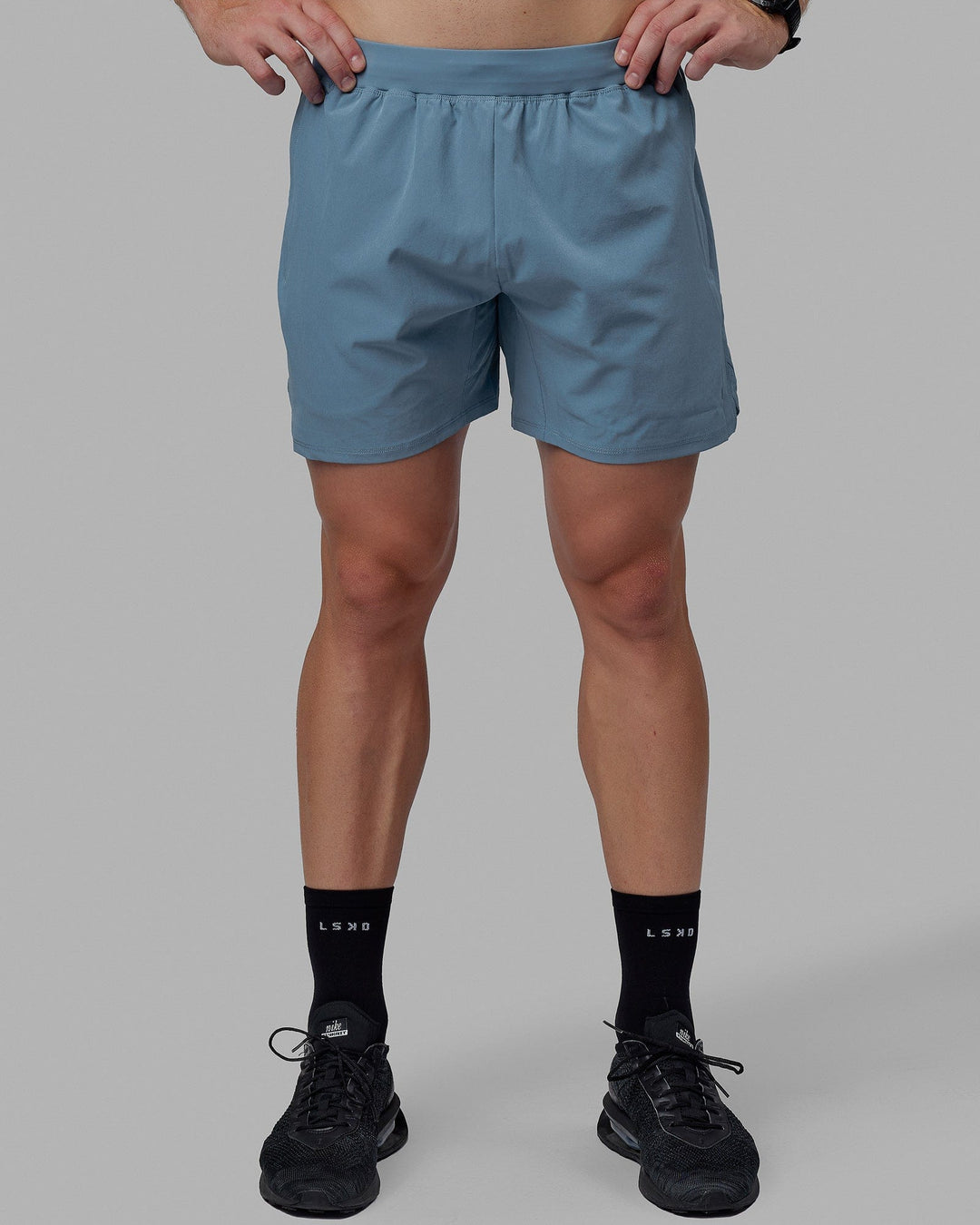 Man wearing Challenger 6&quot; Lined Performance Shorts - Elemental Blue