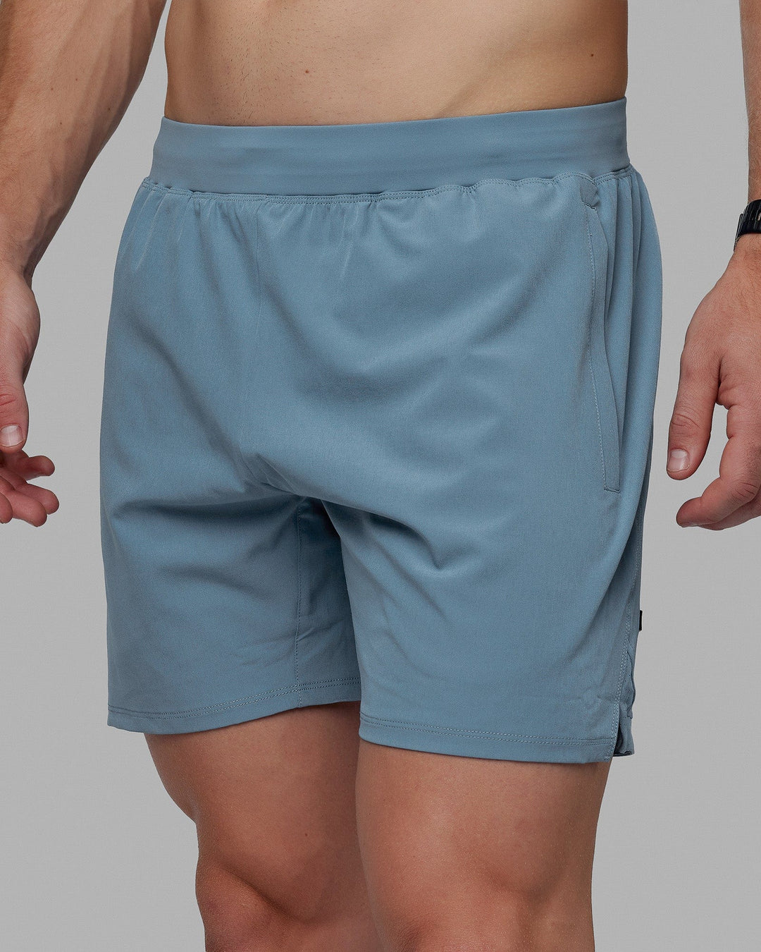 Man wearing Challenger 6" Lined Performance Shorts - Elemental Blue