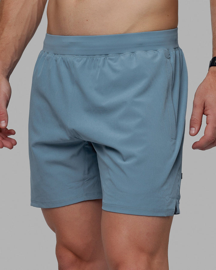 Man wearing Challenger 6&quot; Lined Performance Shorts - Elemental Blue
