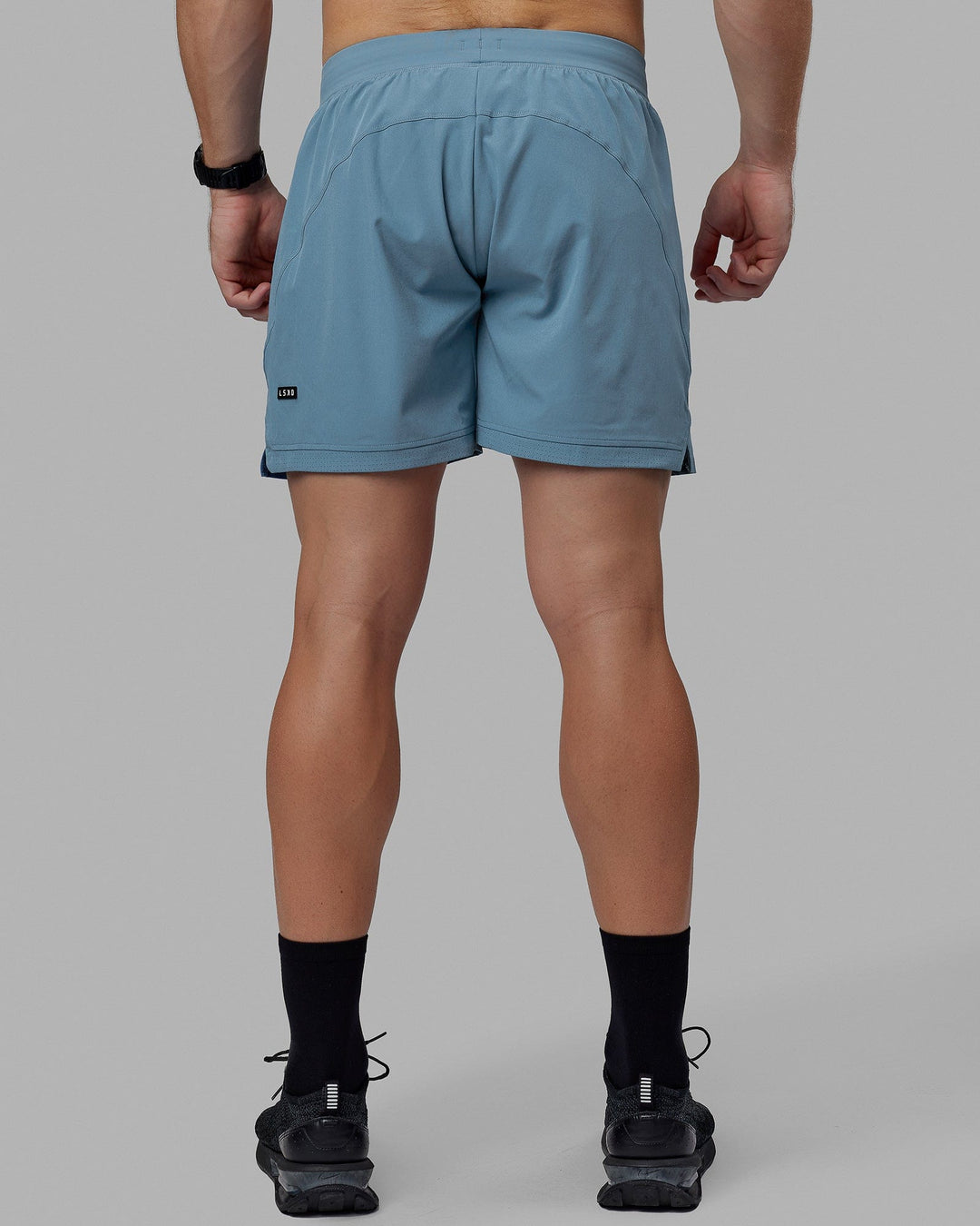 Man wearing Challenger 6&quot; Lined Performance Shorts - Elemental Blue