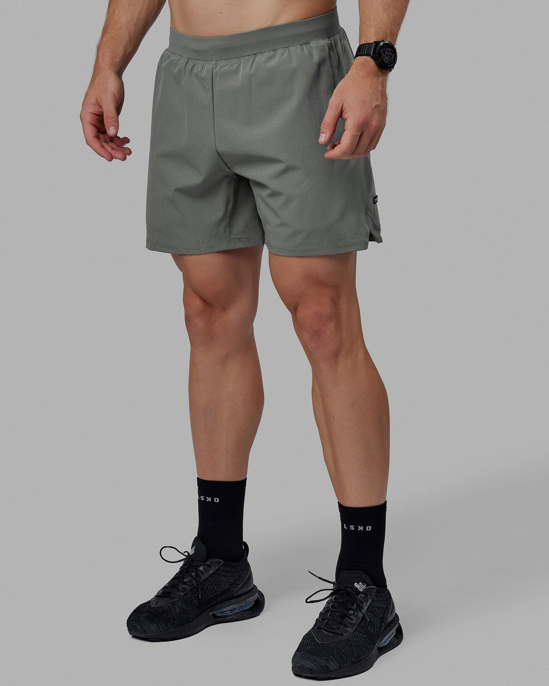 Man wearing Challenger 6" Lined Performance Short - Graphite