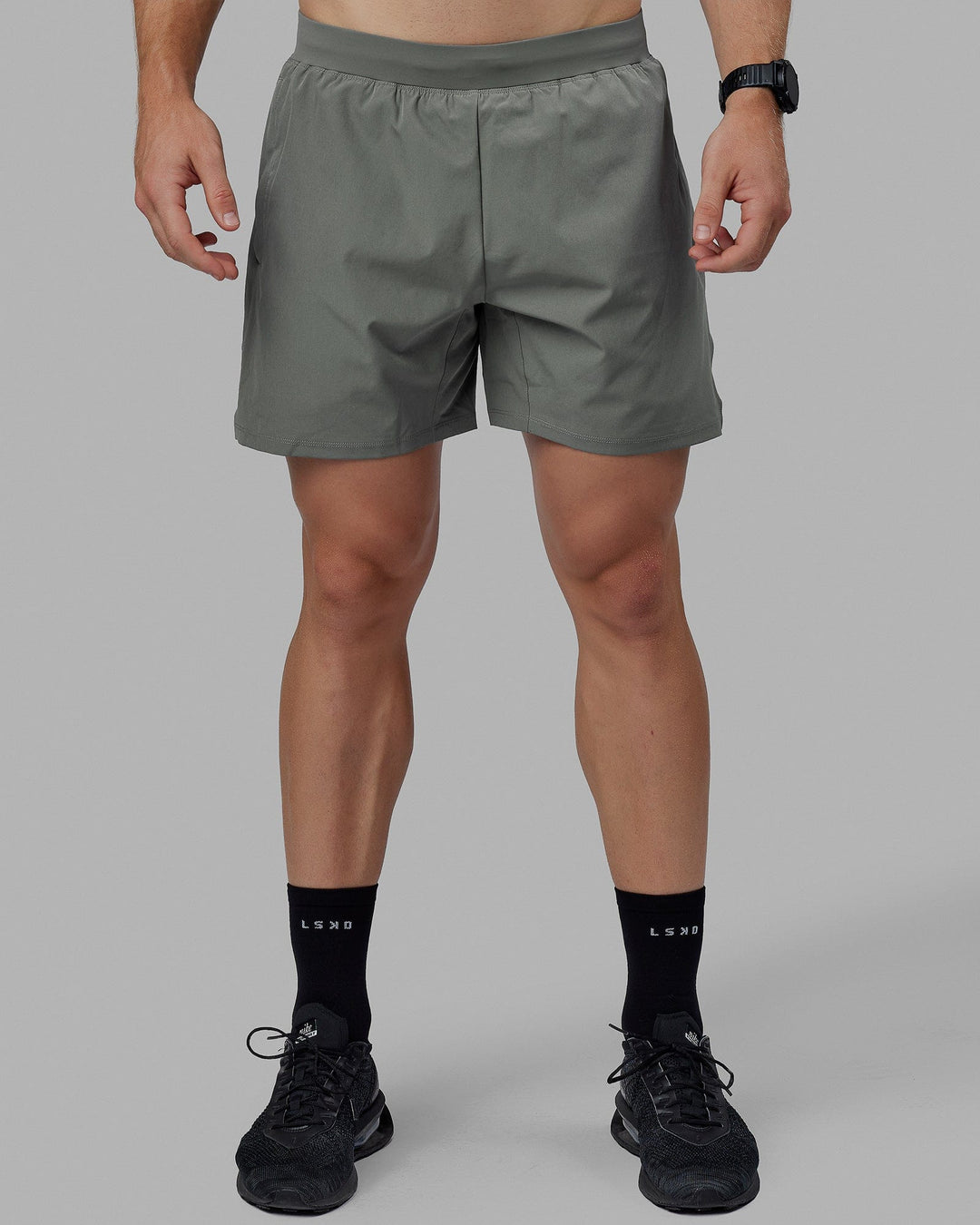 Man wearing Challenger 6&quot; Lined Performance Short - Graphite