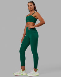 Woman wearing Fusion Ultra High-Rise 7/8 Legging Pockets - Malachite | Model:Sophie | Size:S