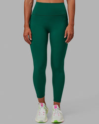 Woman wearing Fusion Ultra High-Rise 7/8 Legging Pockets - Malachite | Model:Sophie | Size:S