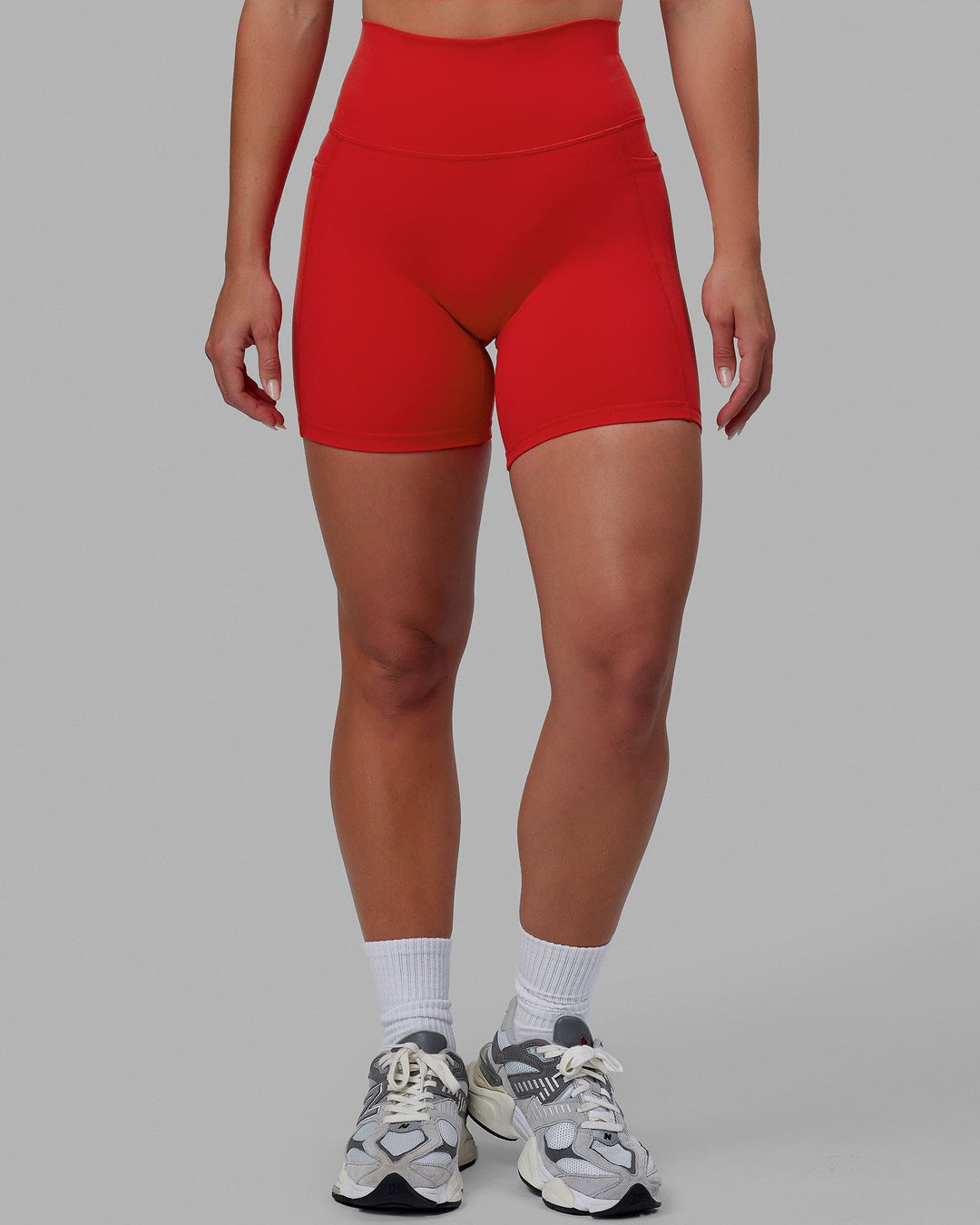 Woman wearing Fusion Ultra High-Rise 6" Short Pockets - Infrared | Model:Annabelle | Size:S
