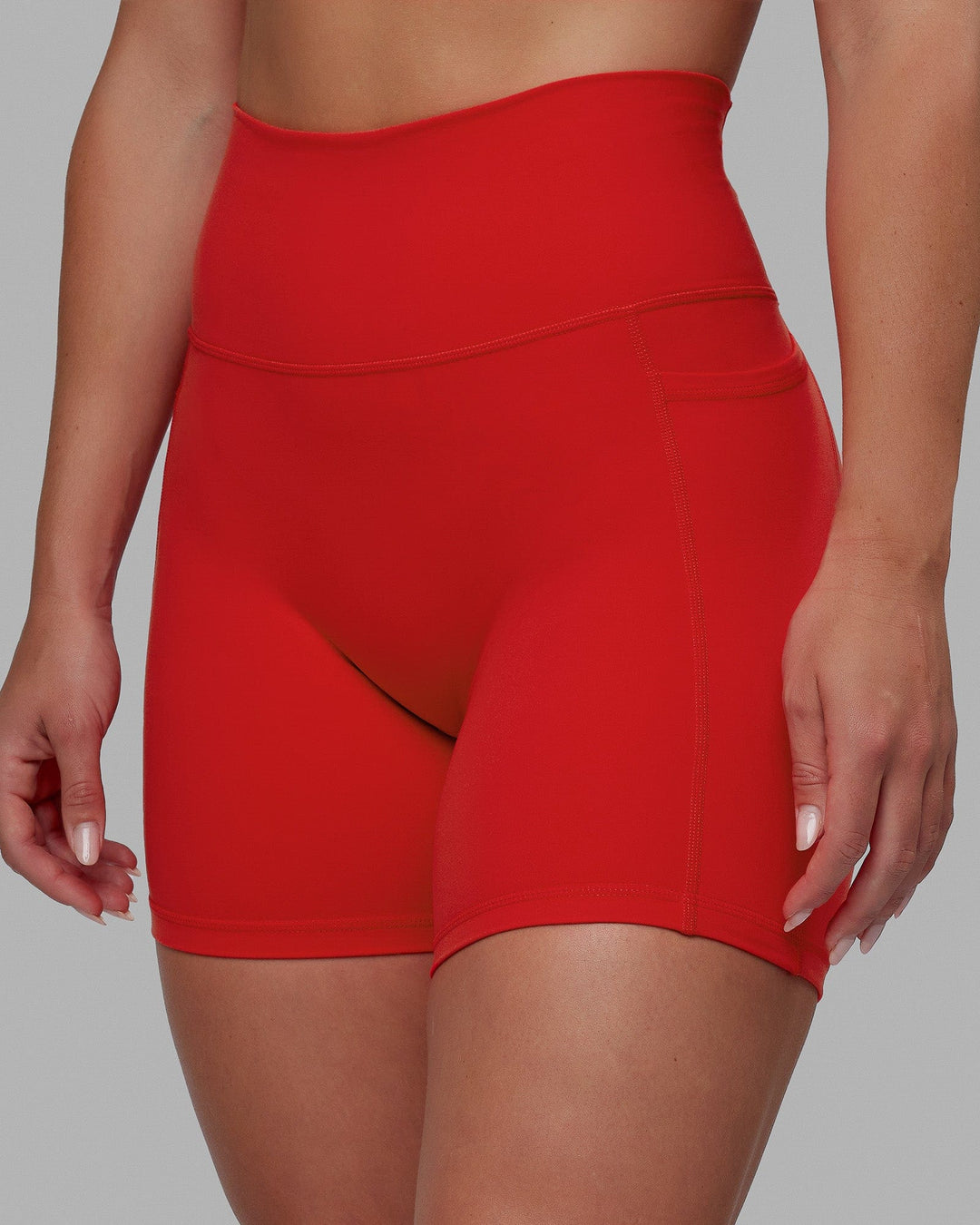 Woman wearing Fusion Ultra High-Rise 6" Short Pockets - Infrared | Model:Annabelle | Size:S