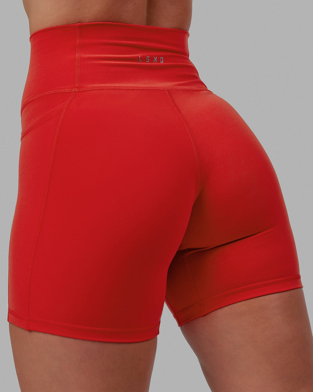 Woman wearing Fusion Ultra High-Rise 6" Short Pockets - Infrared | Model:Annabelle | Size:S
