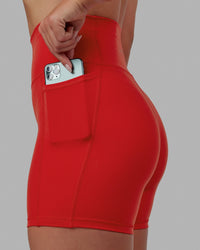 Woman wearing Fusion Ultra High-Rise 6" Short Pockets - Infrared | Model:Annabelle | Size:S