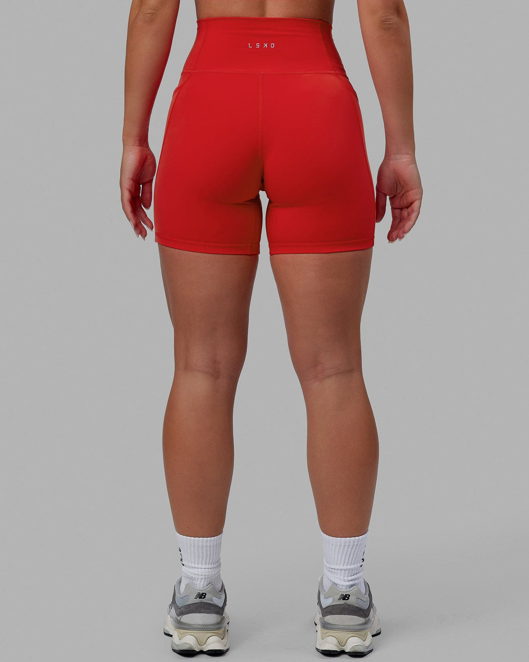 Woman wearing Fusion Ultra High-Rise 6" Short Pockets - Infrared | Model:Annabelle | Size:S