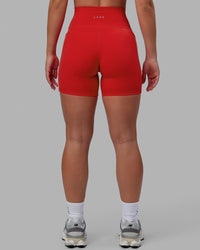 Woman wearing Fusion Ultra High-Rise 6" Short Pockets - Infrared | Model:Annabelle | Size:S