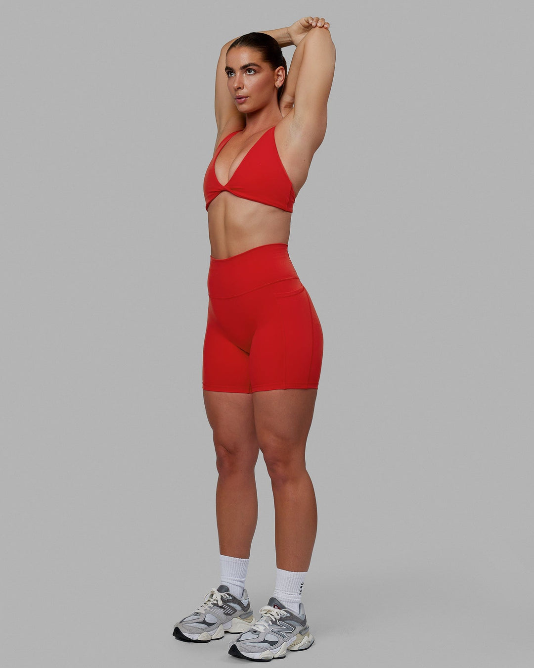 Woman wearing Fusion Ultra High-Rise 6" Short Pockets - Infrared | Model:Annabelle | Size:S