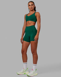 Woman wearing Fusion Ultra High-Rise 4" Short Pockets - Malachite | Model:Sophie | Size:S