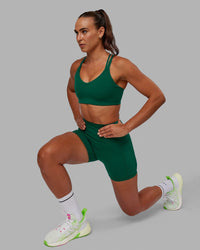 Woman wearing Fusion Ultra High-Rise 4" Short Pockets - Malachite | Model:Sophie | Size:S