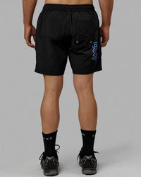 Man wearing Millennium 7" Shorts - Black