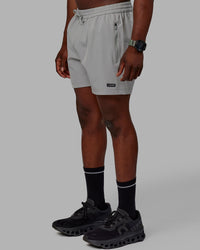 Man wearing Rep 5'' Performance Shorts - Ultimate Grey