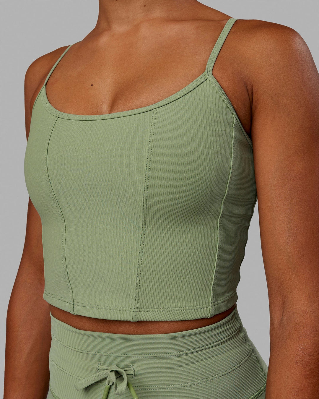 Woman wearing Resistance Ribbed Shelf Bra Performance Tank - Bayleaf