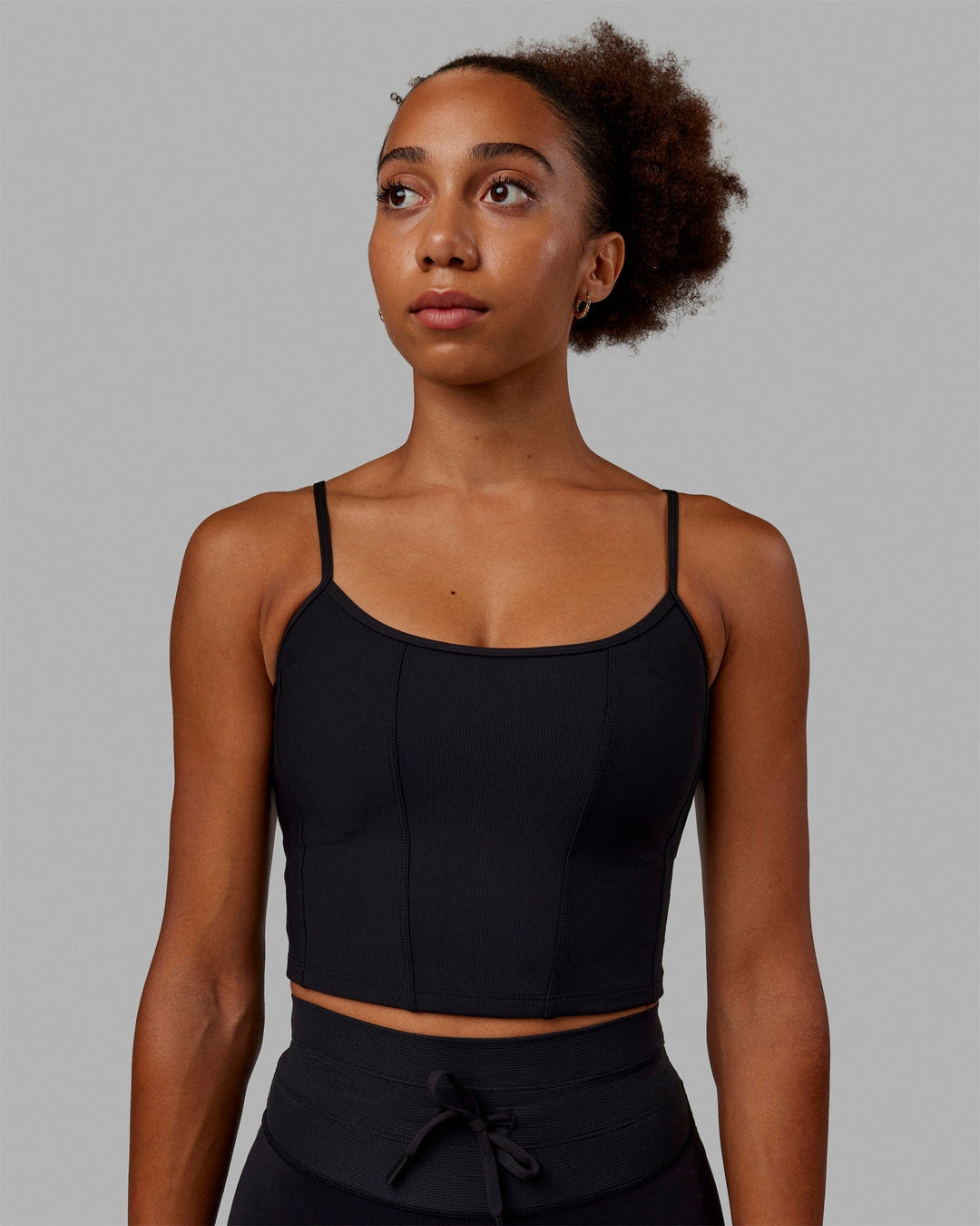 Woman wearing Resistance Ribbed Shelf Bra Performance Tank - Black