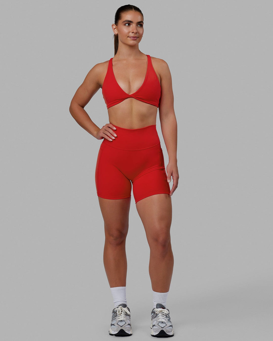 Woman wearing Fusion Ultra High-Rise 6" Short Pockets - Infrared | Model:Annabelle | Size:S