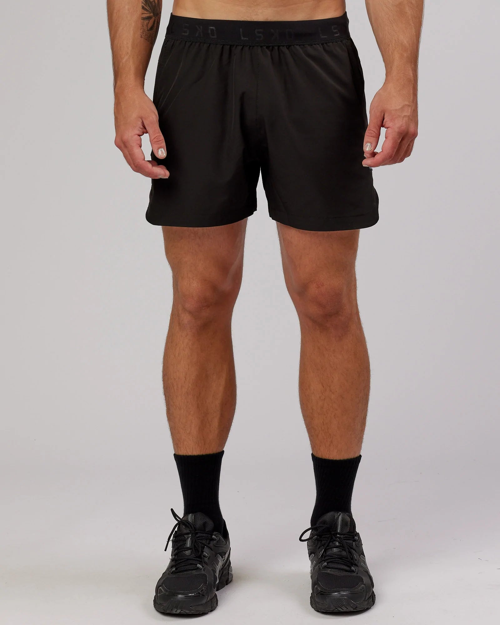 Man wearing Competition 5" Performance Short - Black