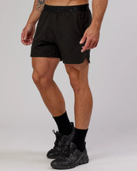 Man wearing Competition 5" Performance Short - Black