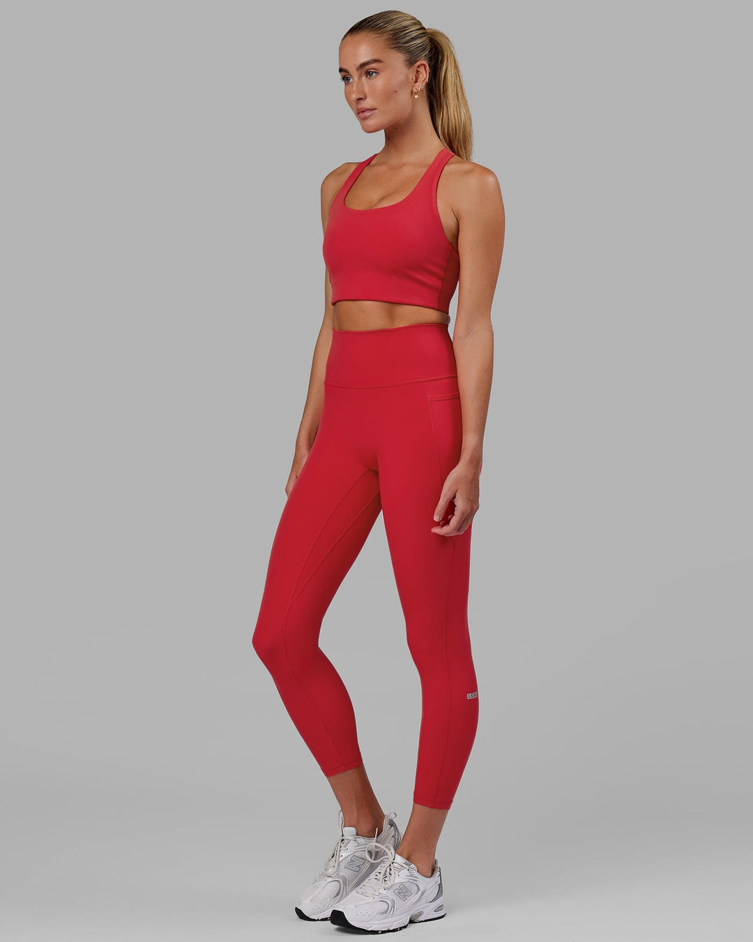 Woman wearing Fusion Ultra High-Rise 7/8 Legging Pockets - Scarlet | Model:Elise | Size:S