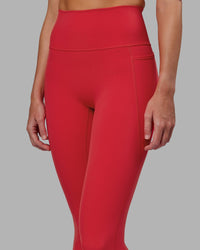 Woman wearing Fusion Ultra High-Rise 7/8 Legging Pockets - Scarlet | Model:Elise | Size:S