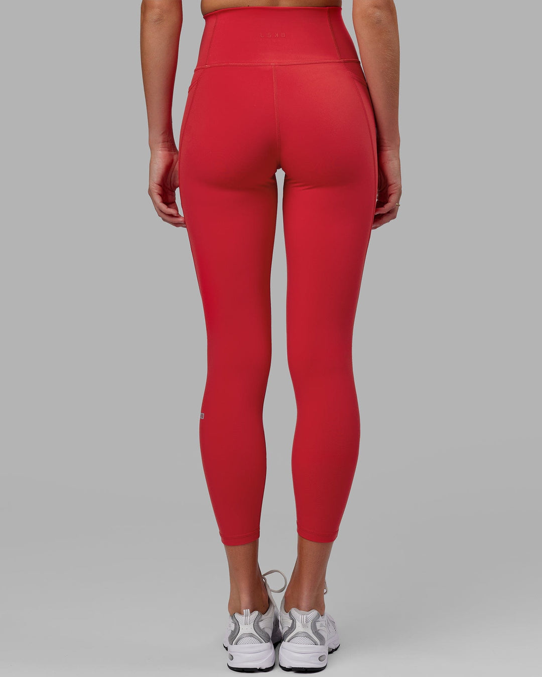 Woman wearing Fusion Ultra High-Rise 7/8 Legging Pockets - Scarlet | Model:Elise | Size:S