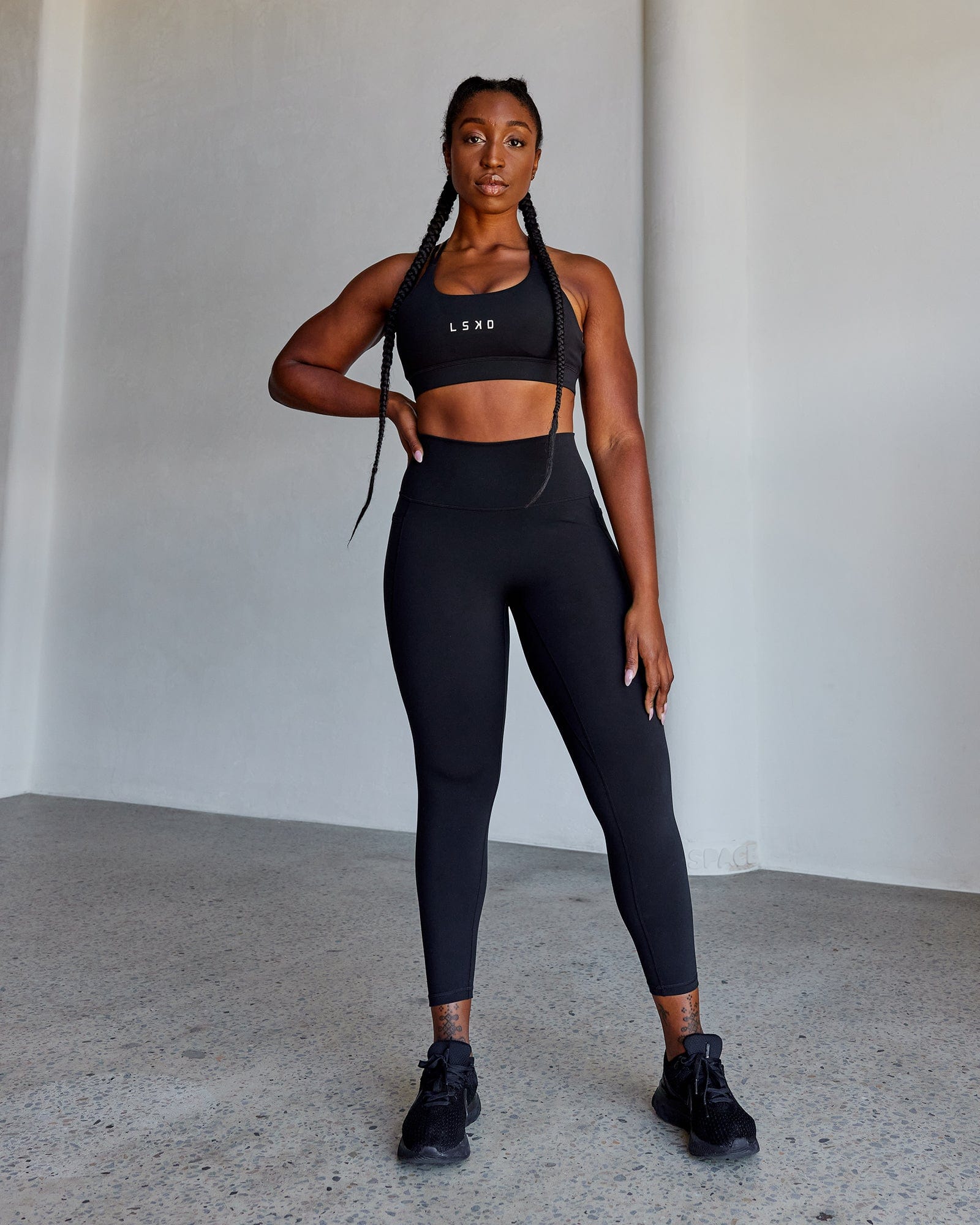 Woman wearing O.G. Fusion Ultra High-Rise 7/8 Legging Pockets - Black | Model:Krystal | Size:L