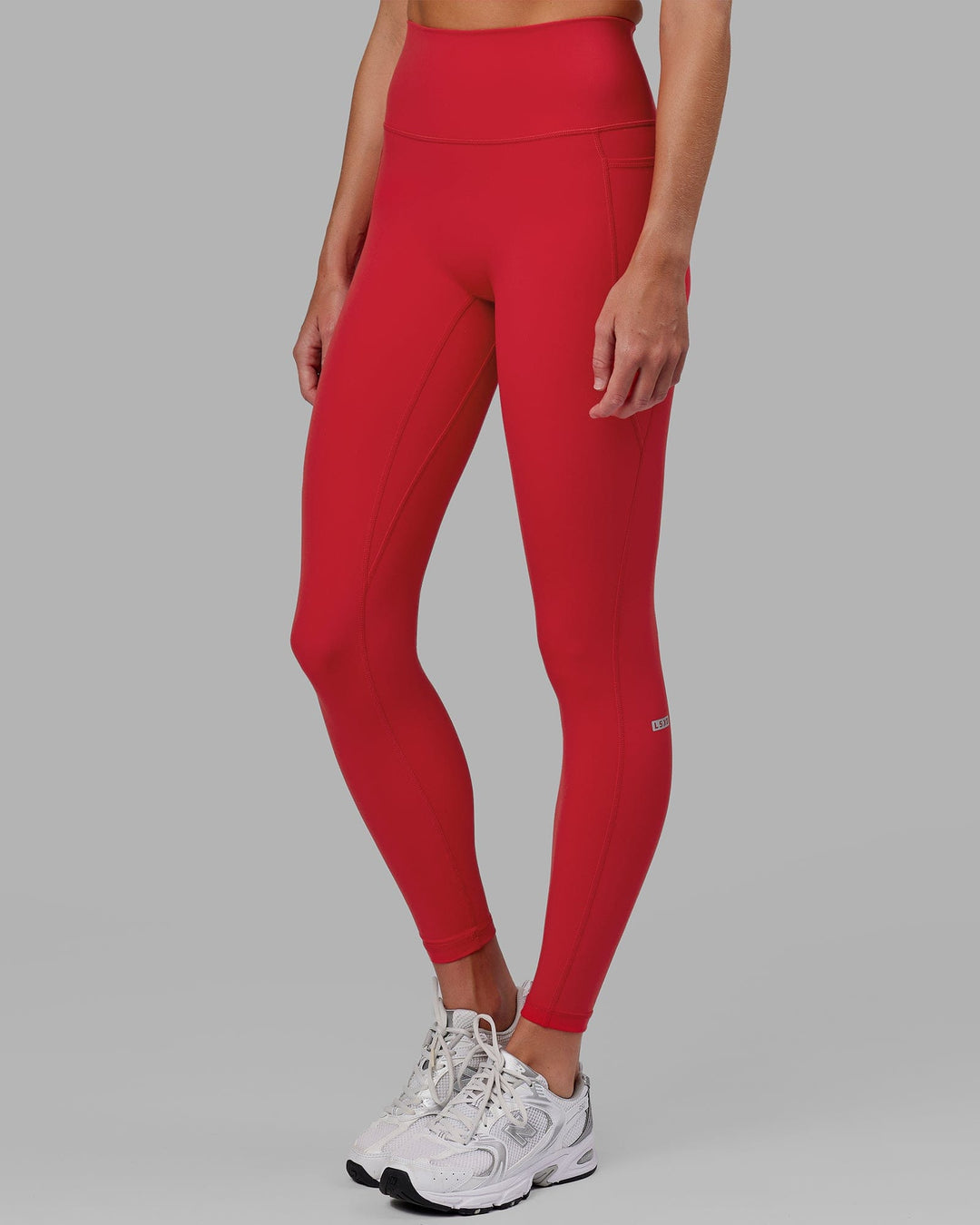 Woman wearing Fusion Ultra High-Rise Full Length Legging Pockets - Scarlet | Model:Elise | Size:S