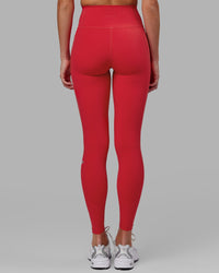 Woman wearing Fusion Ultra High-Rise Full Length Legging Pockets - Scarlet | Model:Elise | Size:S